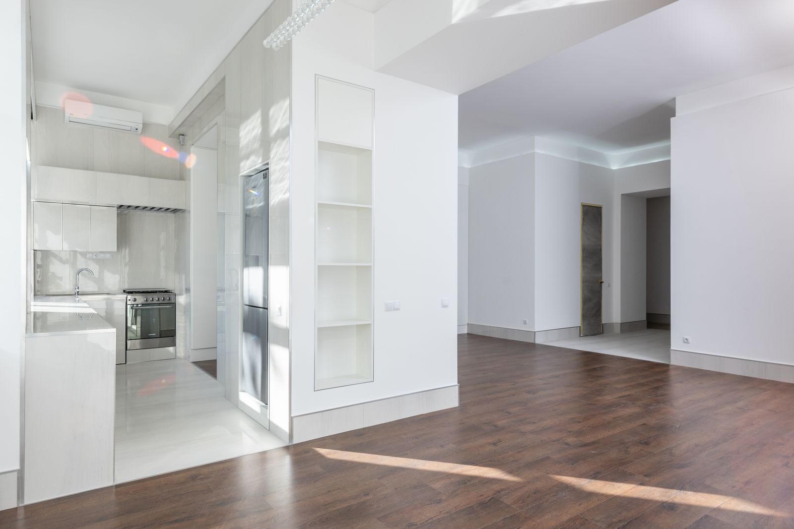 A freshly turned, rent-ready apartment unit with new flooring and updated kitchen